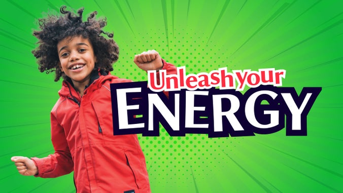 A young boy celebrates against a green backdrop and text shows "unleash your energy"